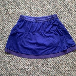 Purple Athleta tennis skirt. Size M. Built in shorts.